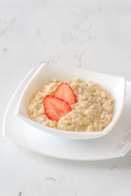 Bowl of oats with fresh strawberries