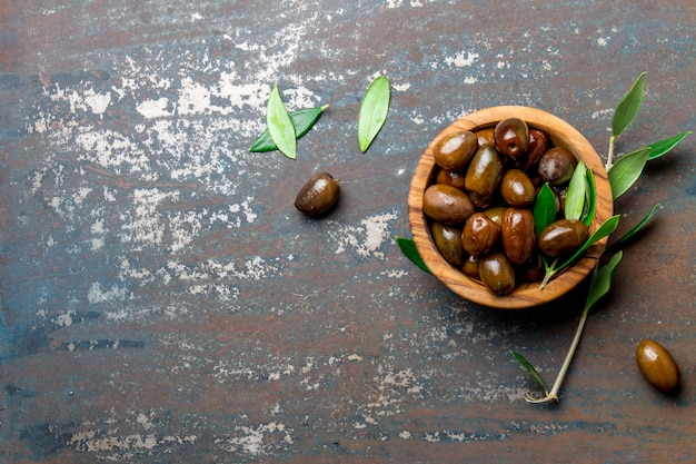 Bowl of olives an olive tree branch