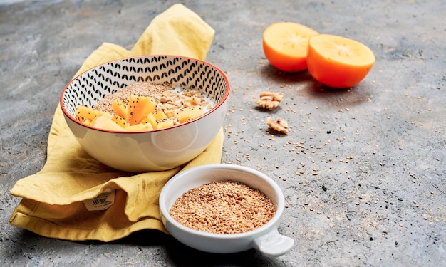 Bowl of porridge with fruits and chia,close up view healthy food concept, vegan