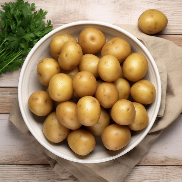 Foto una ciotola di patate con una foglia sul lato