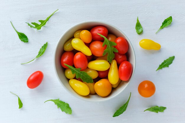 Bowl of red and yellow tomatoes