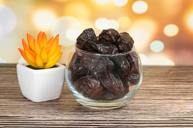 A bowl of safawi dates, popular during fasting month. selective focus points. blurred background