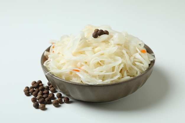 Bowl of sauerkraut on white, close up