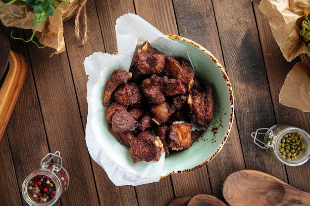 Bowl of small lamb ribs appetizer