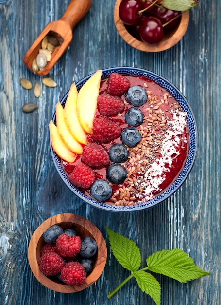 Bowl smoothie with berries and fruits top view