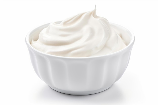 A bowl of sour cream on a white background