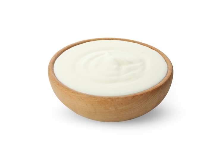 Photo bowl of sour cream yogurt isolated on white
