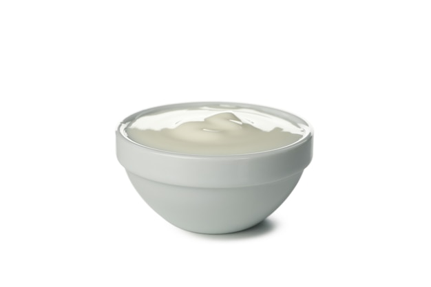 Bowl of sour cream yogurt isolated on white