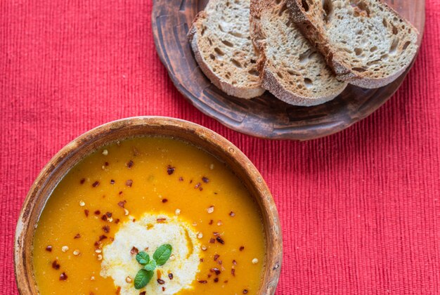 Bowl of spicy pumpkin cream soup: top view