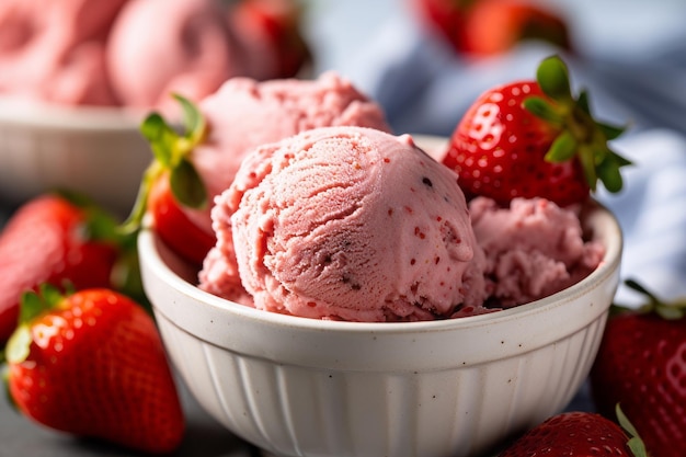 A bowl of strawberry ice cream with a bowl of strawberry ice cream in the background