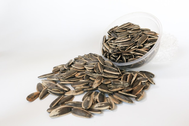 Bowl of Sunflower seeds isolated on white background