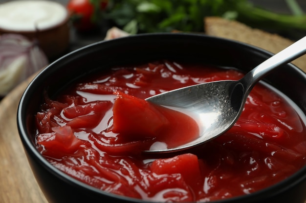 Bowl of tasty beetroot soup, close up