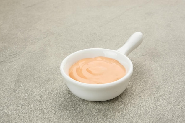 Bowl of tasty mayonnaise copy space