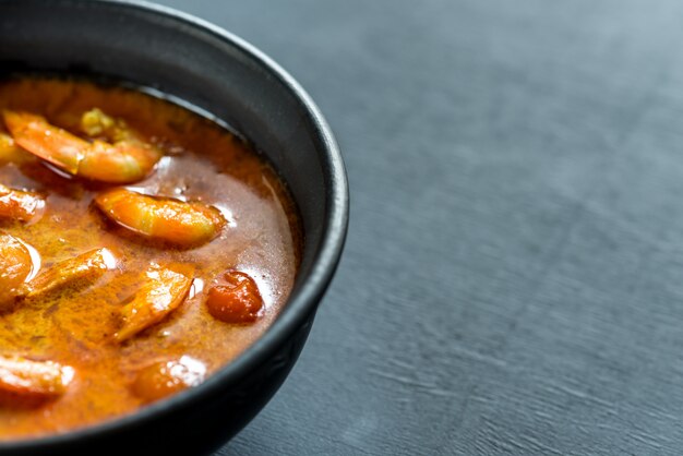 Bowl of thai yellow curry with seafood