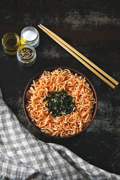 A bowl of tomato noodles. Colorful healthy food in the style of flat lay