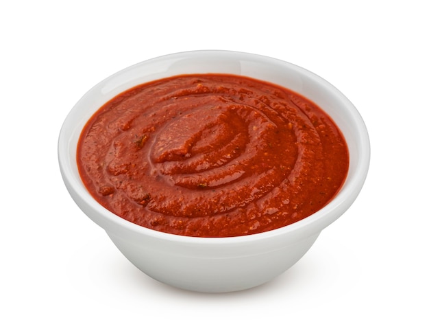 Bowl of tomato soup isolated on white background