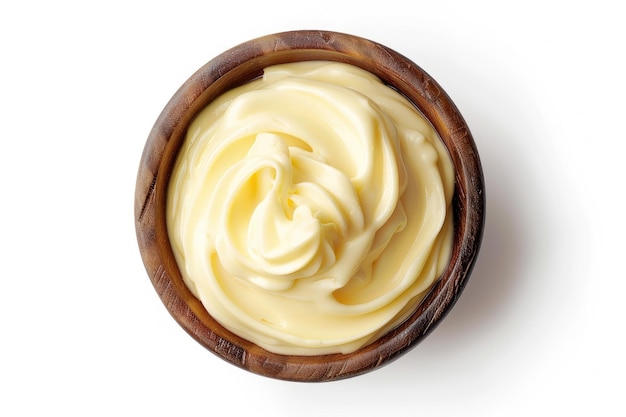 Bowl of vanilla custard on white background top view