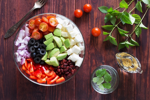 Bowl of vegetable salad with tomatoes and avocado