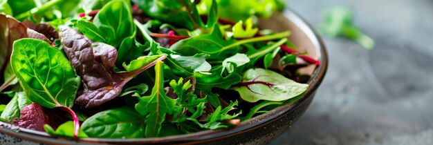 Photo bowl of vibrant salad greens showcasing the fresh textures and colors of the mixed greens generative ai