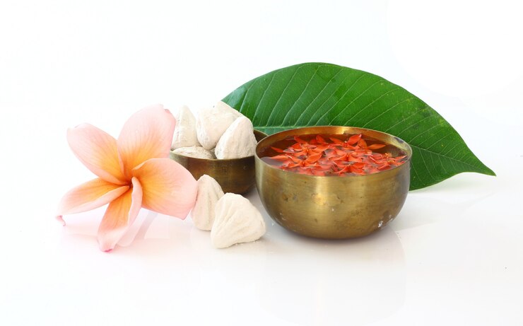 Bowl of water,flower and clay  on white for Songkran festival