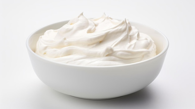 a bowl of whipped cream on a white surface