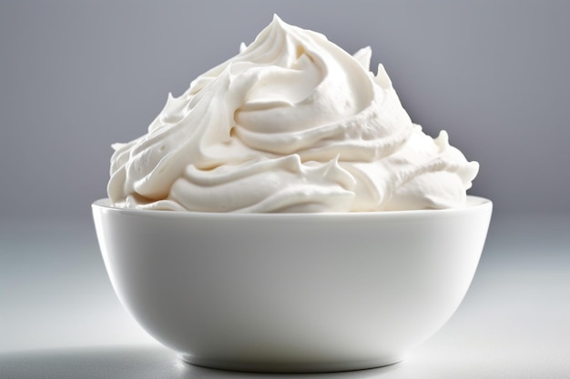 a bowl of whipped cream with a white cream in it.