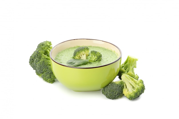 Bowl with broccoli soup isolated on white