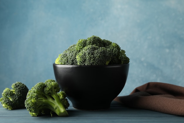 Bowl with broccoli on wooden table. Healthy food