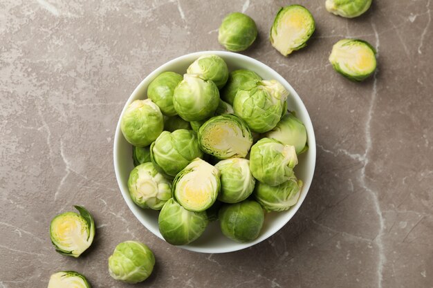 Bowl with brussels sprout on grey surface