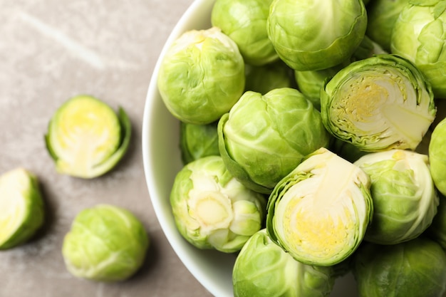 Bowl with brussels sprout on grey surface