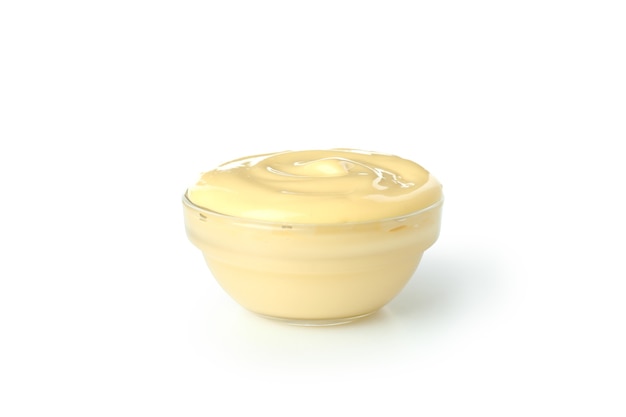 Bowl with cheese sauce isolated on white background