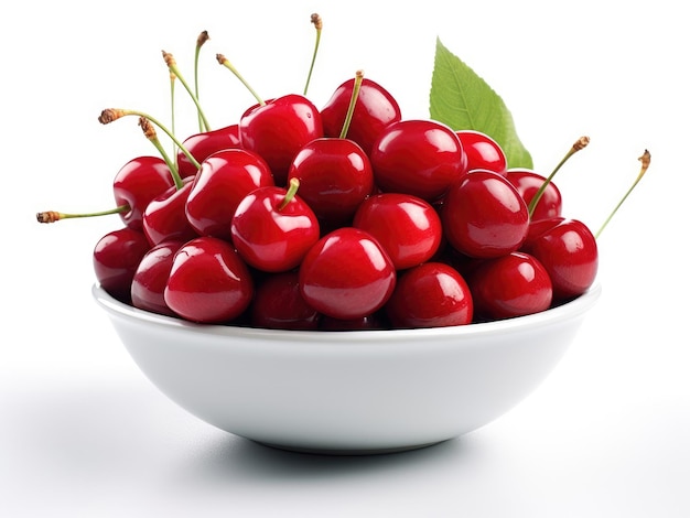 Bowl with cherries and green leaves on a white background