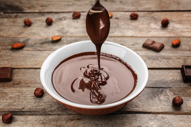 Bowl with chocolate mousse,on wooden surface