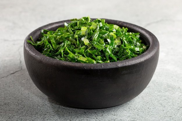 Photo bowl with chopped green cabbage sauteed in olive oil and garlic.