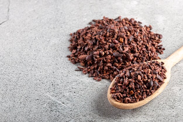 Bowl with cocoa nibs on the table