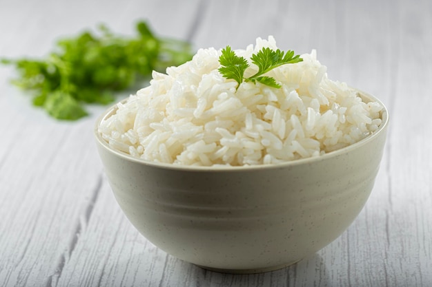 Bowl with cooked rice on the table