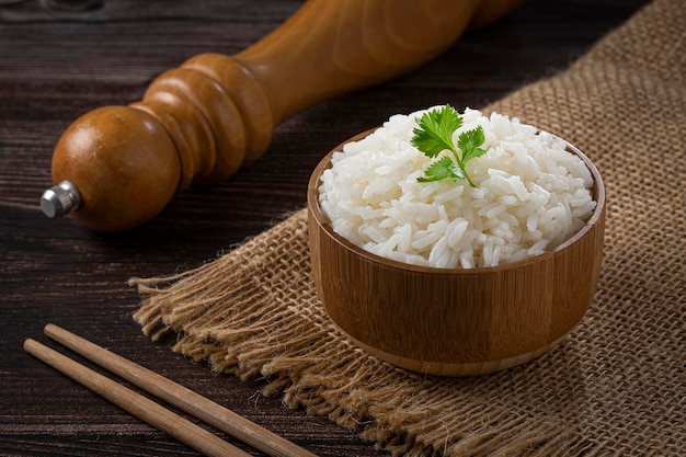 Bowl with cooked rice on the table