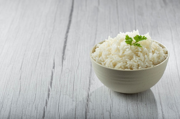 Bowl with cooked rice on the table