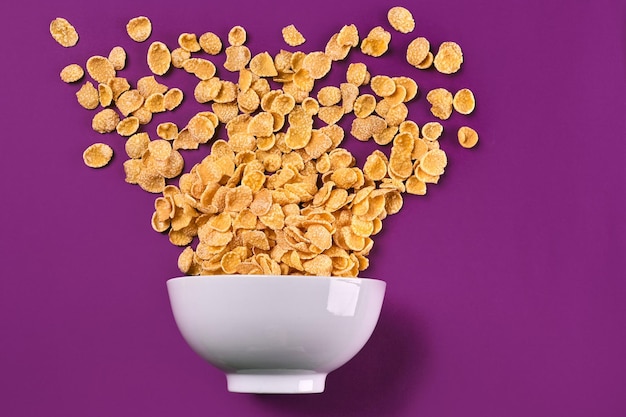 Photo bowl with cornflakes on the colorful background