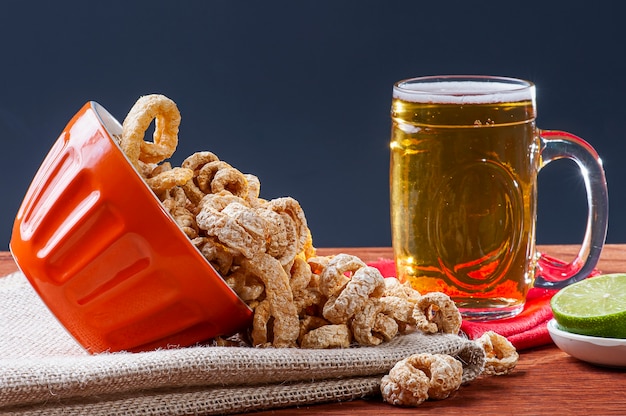 bowl with crackling and beer