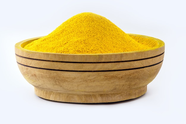 Bowl with curry powder, turmeric powder spice, ground turmeric powder