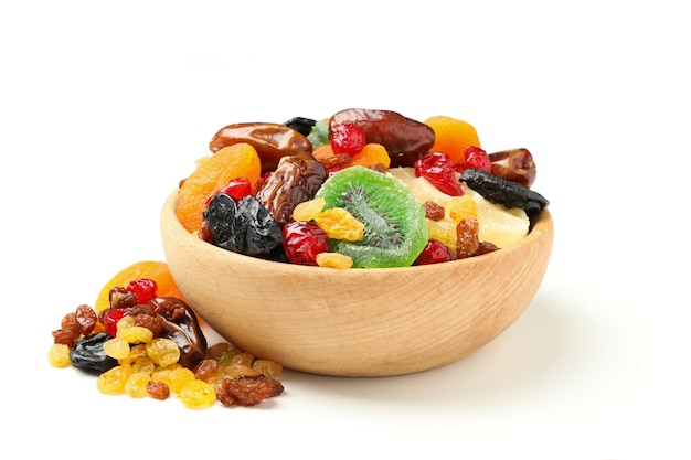 Bowl with dried fruits isolated on white background