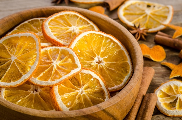 Bowl with dry orange slices and spices