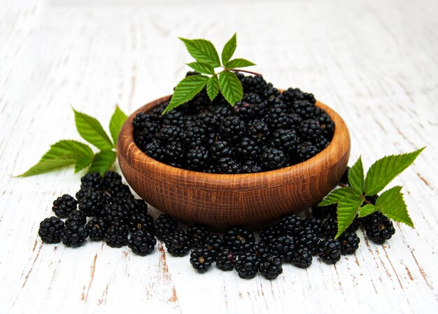 Bowl with fresh blackberries on a table