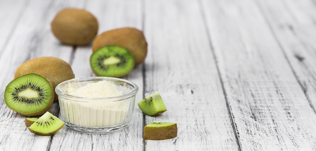 Bowl with fresh made Kiwi powder selective focus