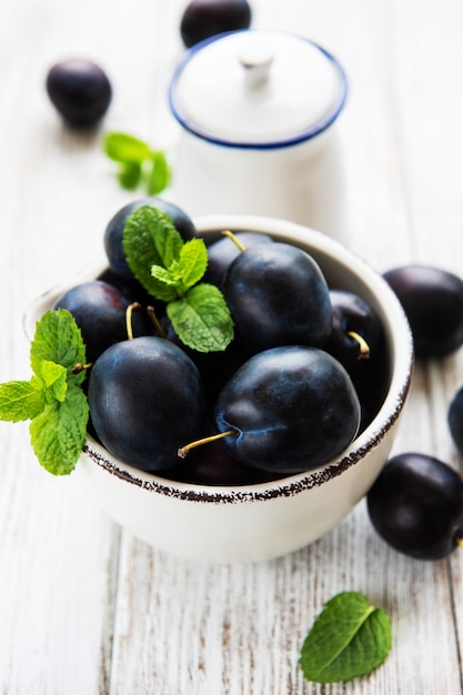 Bowl with fresh plums