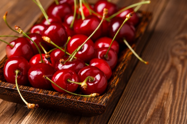 Bowl with fresh red Cherries.