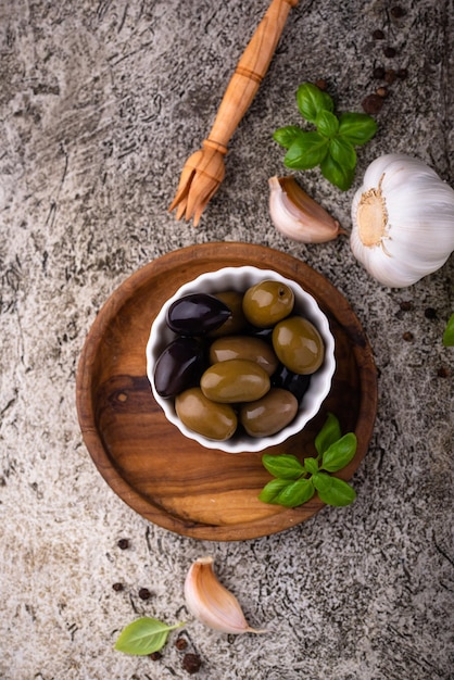 Bowl with greek green and black olives