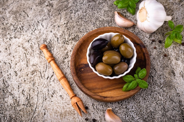 Bowl with greek green and black olives