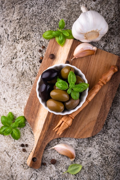 Bowl with greek green and black olives